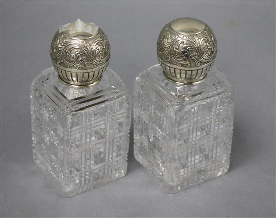 A pair of late Victorian silver mounted rectangular cut glass scent bottles, John Newton Mappin, London, 1891, 15.2cm.